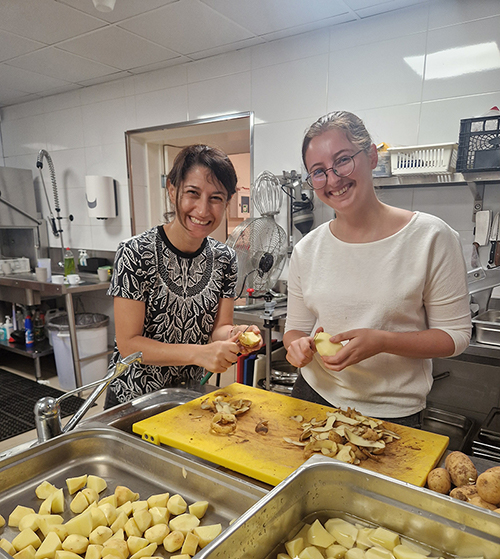 Mamo TCV Advocates associates – Veronica Grixti (left) and Tessa Borg Bartolo (right) giving a helping hand at the Soup Kitchen